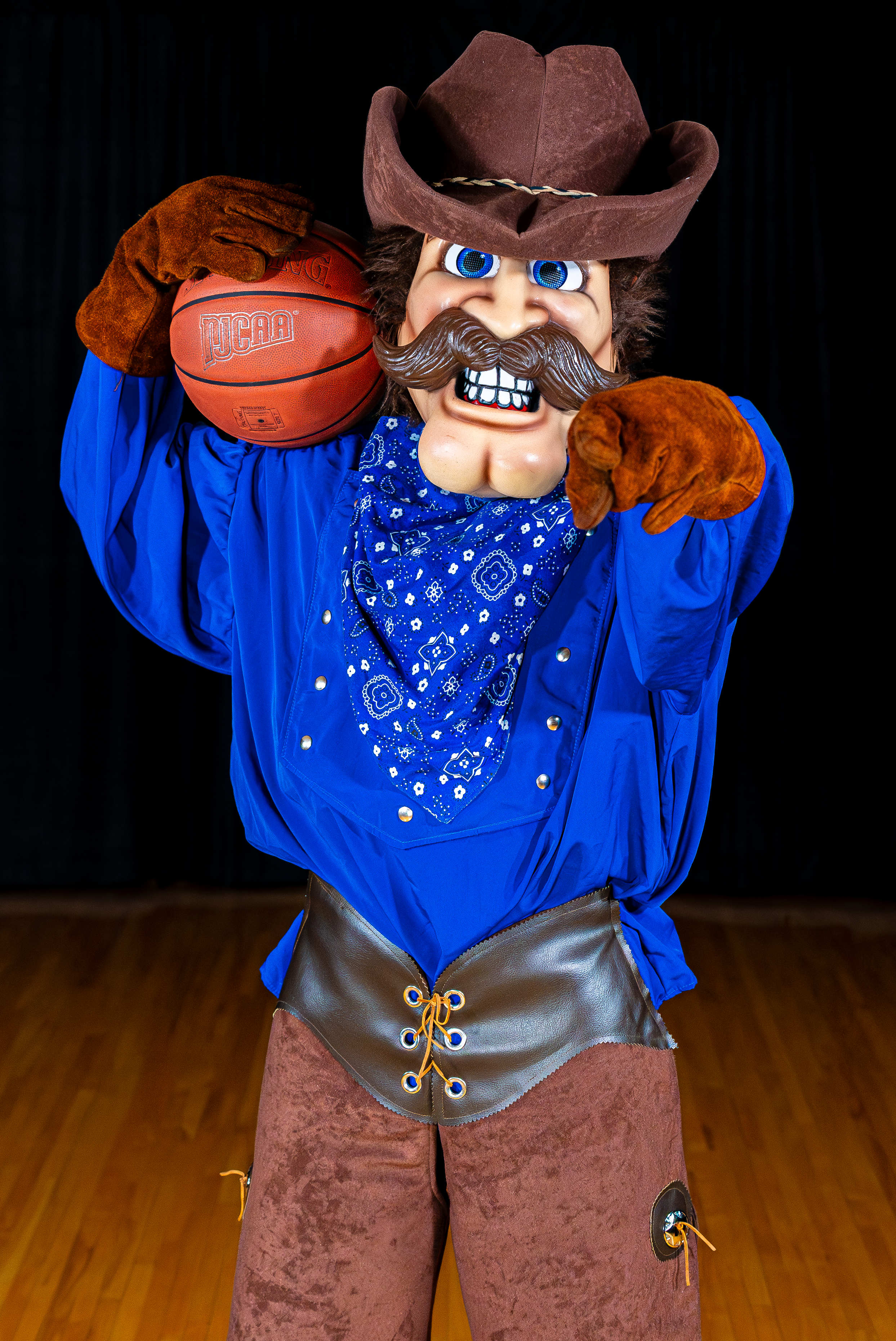 Willy the mascot with a basketball ball