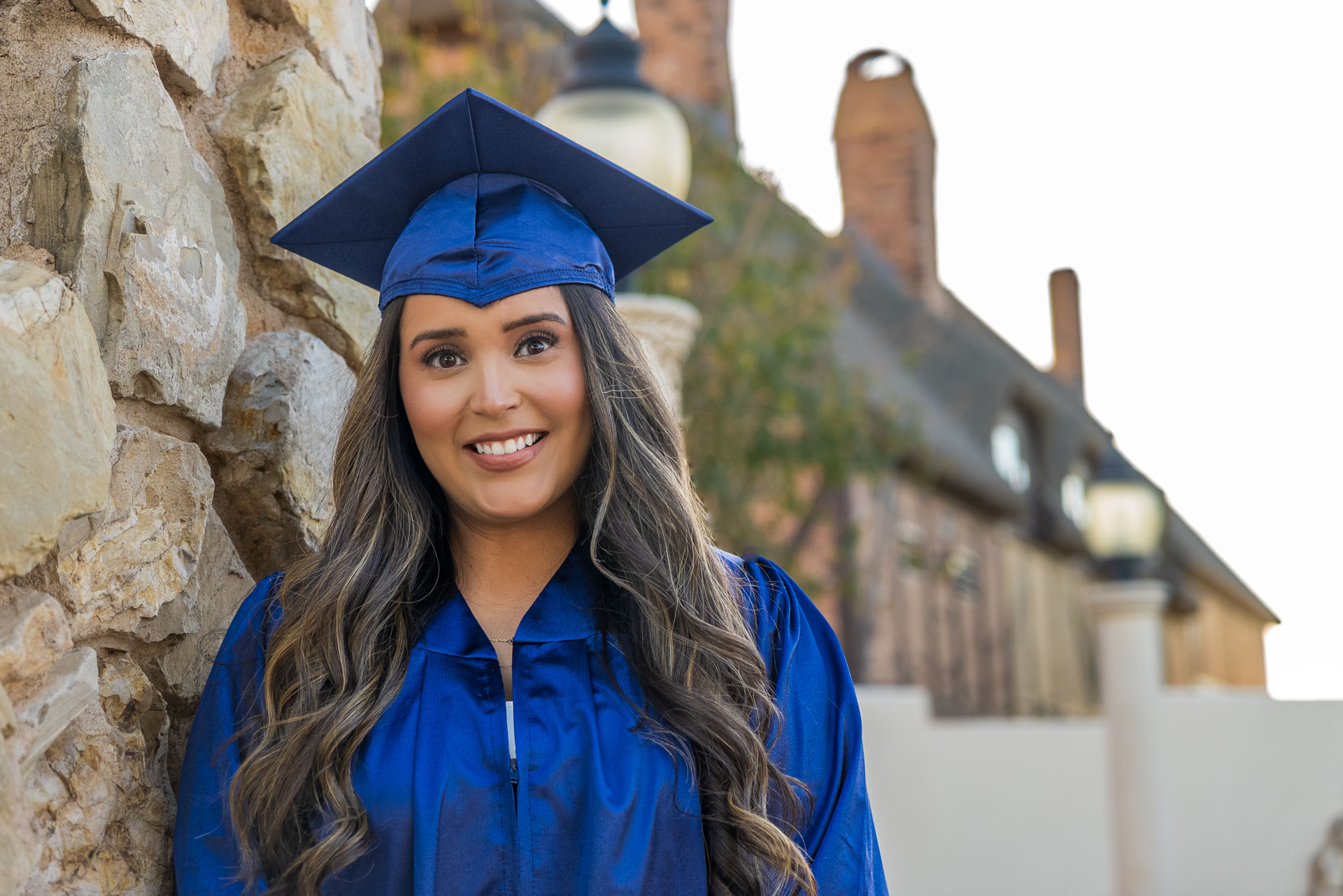 Dalia Mendoza-Salgado posing against a stone wall