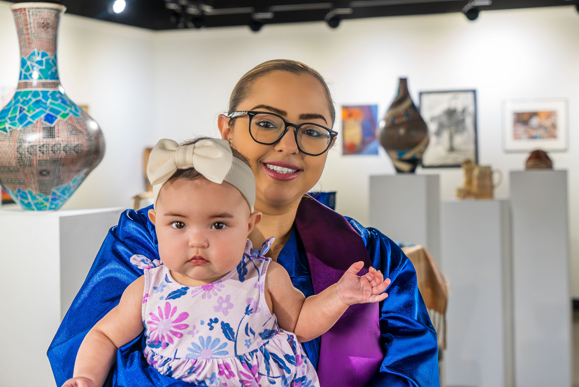 Carla Soria and her daughter at the art exhibit