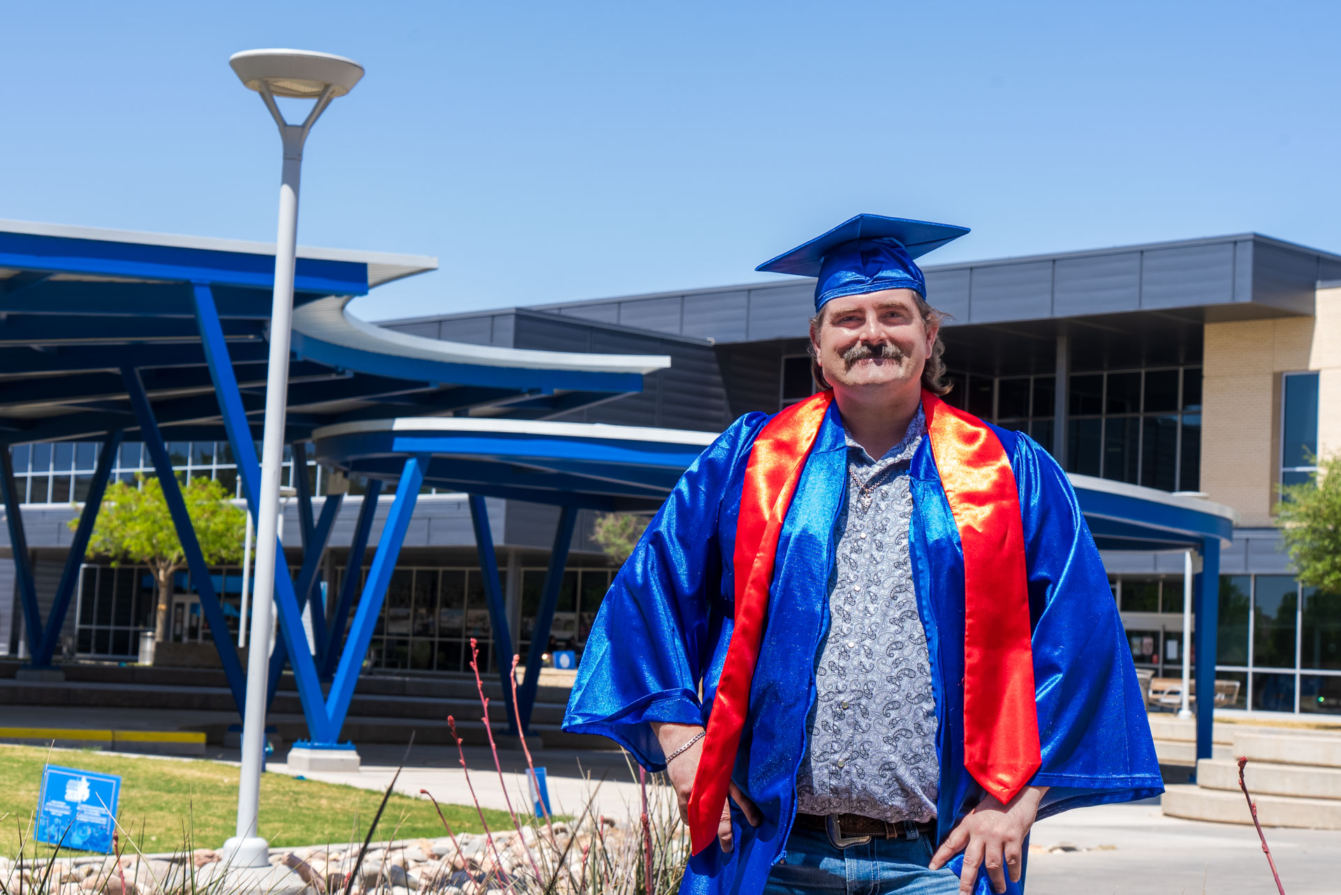 Dustin Howard standing in front of amphitheater