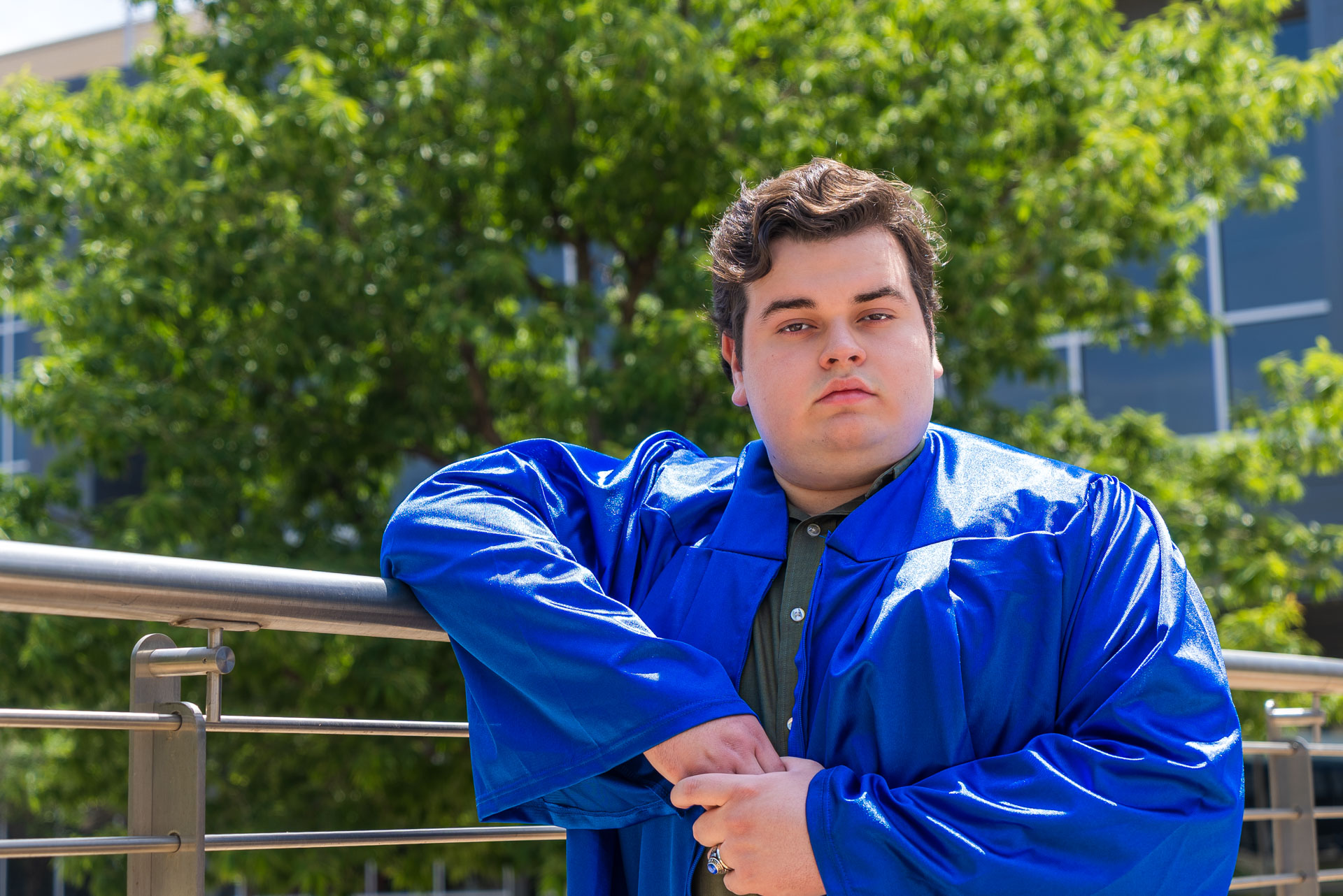 Joel Alvidrez posing next to railing