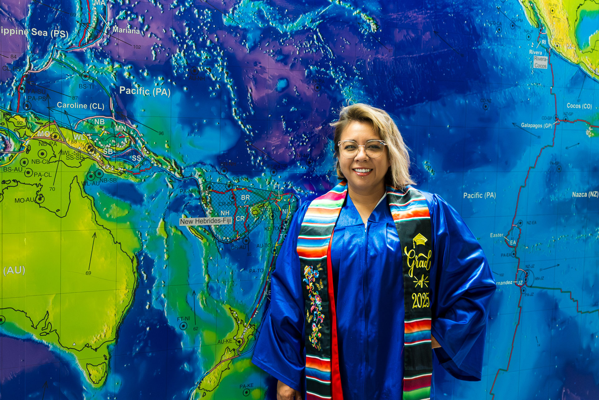 Yaribel Garcia smiling in front of map