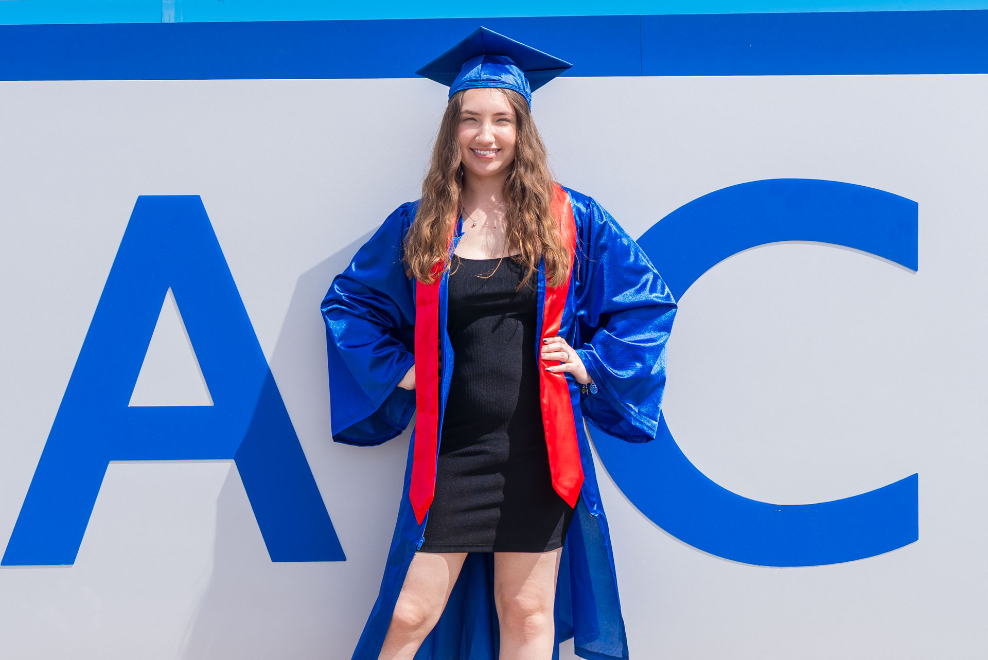 Aubree Lara in front of OC sign