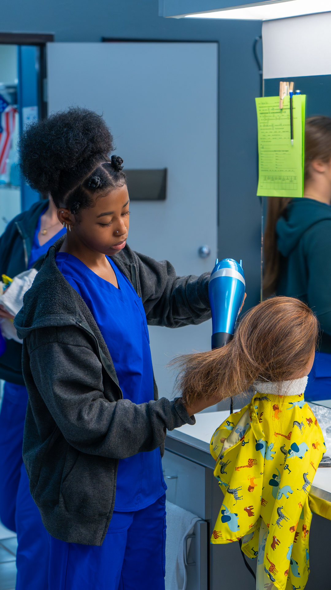 Afro woman drying hair