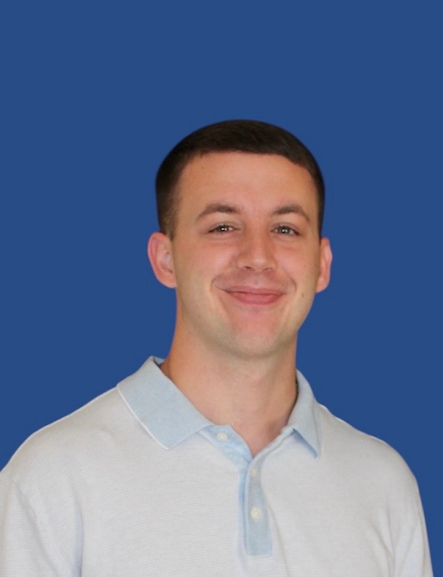 Male counselor smiling at the camera
